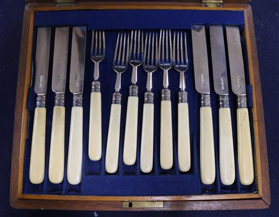 A cased set of twelve pairs of Edwardian ivory handled silver dessert eaters, Atkin Brothers, Sheffield, 1902.